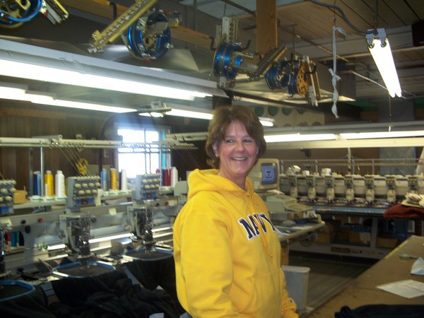 Woman In An Embroidery Warehouse